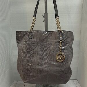 Michael Kors gray snakeskin bag.Snap close. 5 interior pockets.Gold hardware.GUC